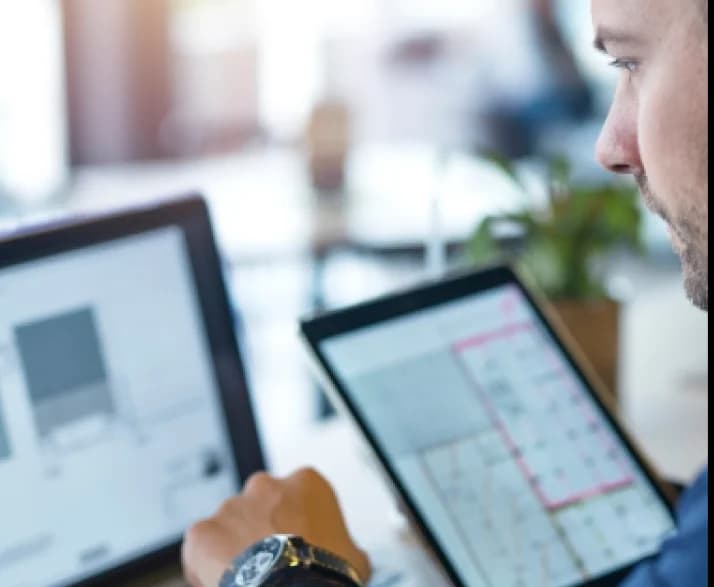 man looking at cad program in his computer